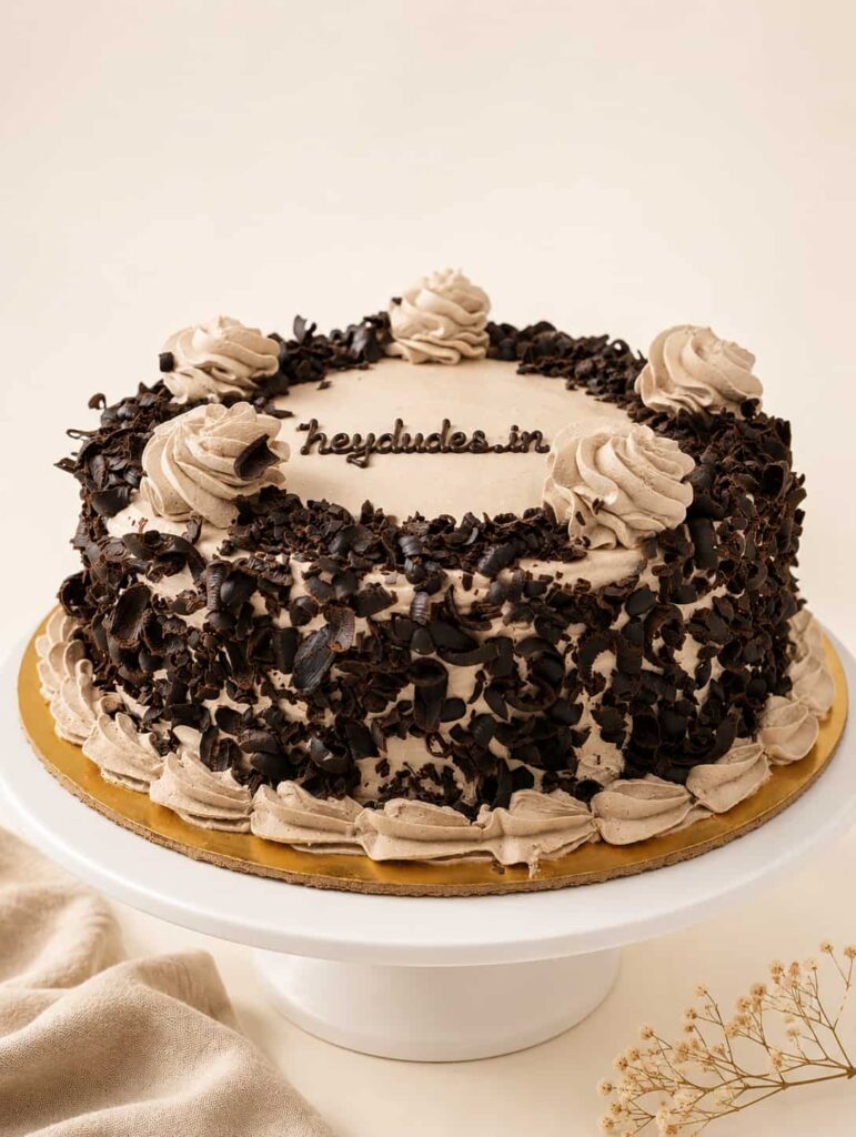 Choco Forest Cake with rich chocolate sponge, fresh whipped cream, and premium chocolate shavings, available for online cake delivery in Chennai from Heydudes Cake Cafe.